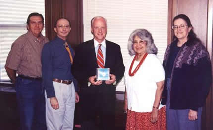 Committee members Mike Pace, Jim Rementer, Mary Louise Watters, and Janifer Brown present a Lenape Language CD to former Oklahoma Governor Frank Keating.